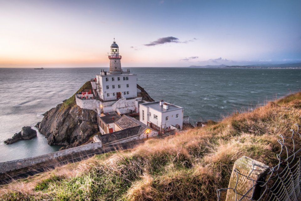 ‘Sunrise in Bailey lighthouse Dublin’ by Giuseppe Milo is licensed under CC BY 2.0.