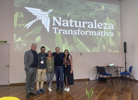 Speakers standing on the stage at the launch event for Naturaleza Transformativa.