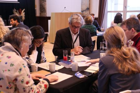 people round a table at an event