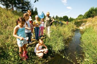 children by a stream 