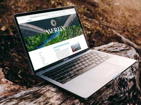 MERLIN website mock up on a laptop screen