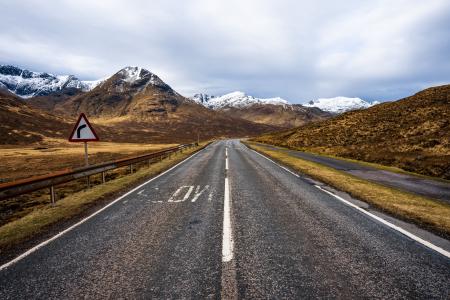 The highway and beautiful mountain vistas in Scottish Highlands near Isle of Skye Scotland UK