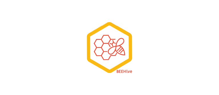 biomaterials logo - orange outline with honey comb and bee on top