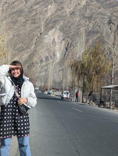 Smiling girl in front of a mountain