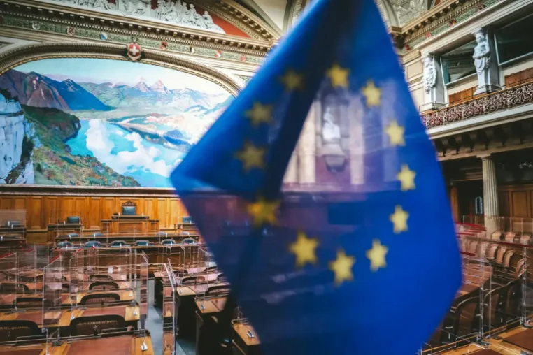 EU flag up close with office background