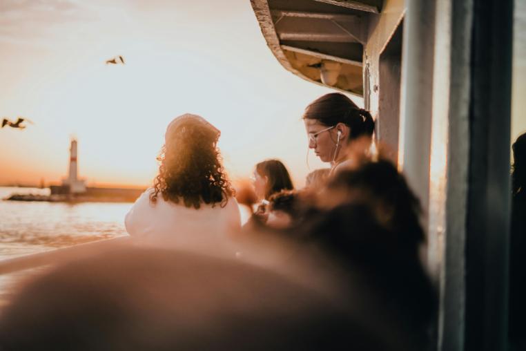 People on a boat on a sunset